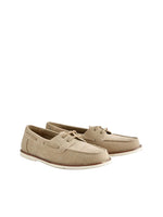 Pair of beige suede shoes on a light gray background