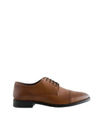 Brown leather dress shoe on a light gray background