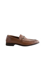 Brown leather loafer with a metal buckle on a light gray background