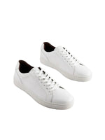 White sneakers on a light gray background