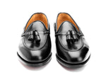 Premium black tassel loafers crafted from genuine leather for formal and business wear.