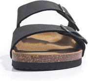 A black double-strap sandal with a cork midsole and a tan footbed, shown from a side angle on a white background.