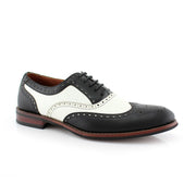 A handcrafted pair of black and white wingtip Oxford shoes made from premium genuine leather, designed for modern gentlemen who appreciate timeless craftsmanship and refined style.