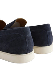 Navy blue suede shoes with white soles on a light gray background