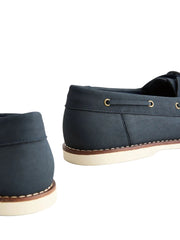 Pair of navy blue shoes with brown accents on a light gray background