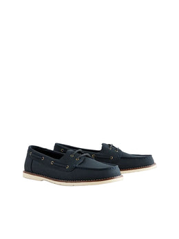 Pair of navy blue leather shoes on a light gray background