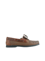 Brown boat shoe on a light beige background