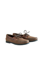 Pair of brown boat shoes on a white background