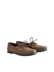 Pair of brown boat shoes on a white background
