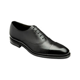 Black leather dress shoe on a white background
